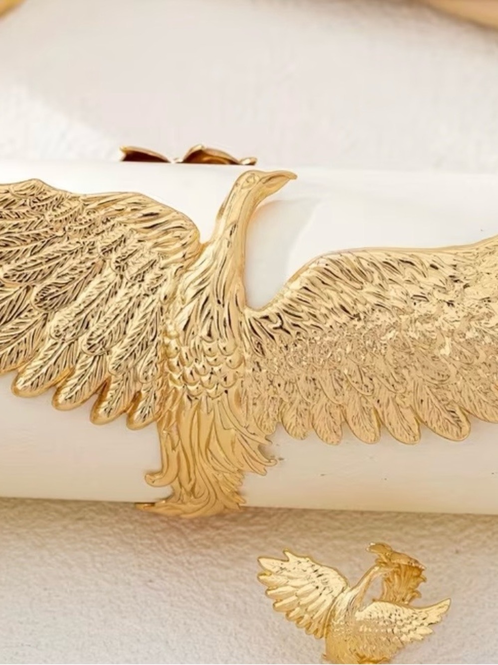 Beautiful bird wrap bracelet and matching ring in gold .